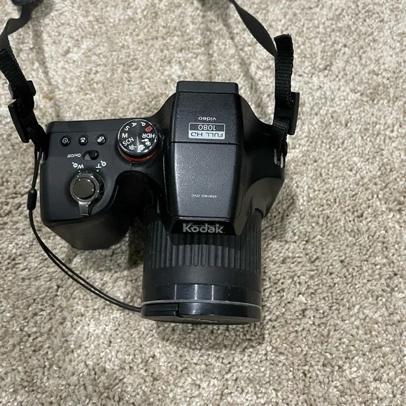 Black Kodak camera with accessories